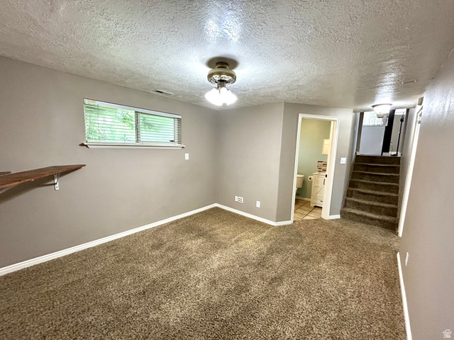 441 South 400 East Payson, UT 84651 - Photo 24 of 39 Carpeted room with a ceiling-mounted light fixture, a window with blinds, and a built-in wood shelf