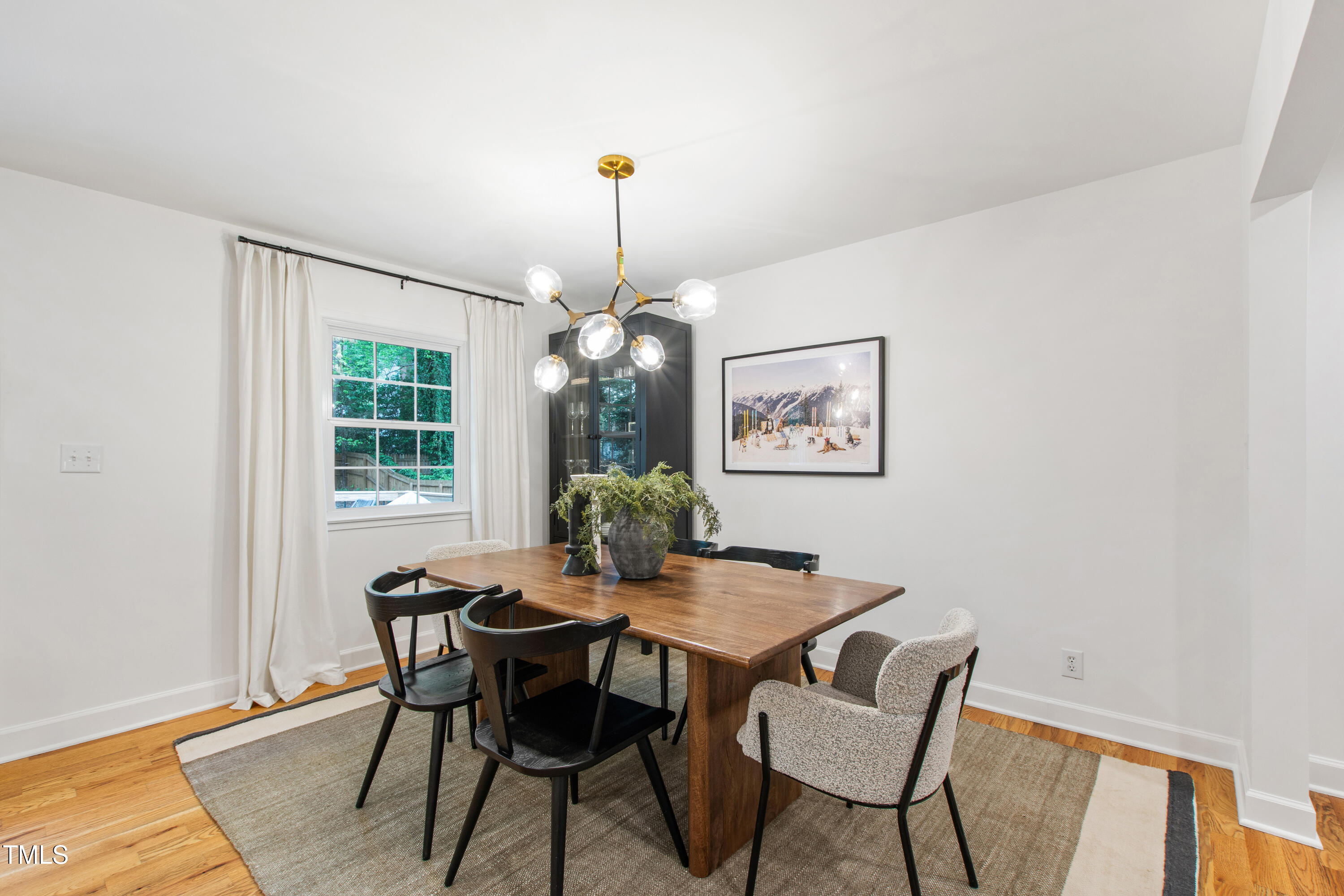 7409 Fiesta Way Raleigh, NC 27615 - Photo 13 of 40 a view of a dining room with furniture window and wooden floor