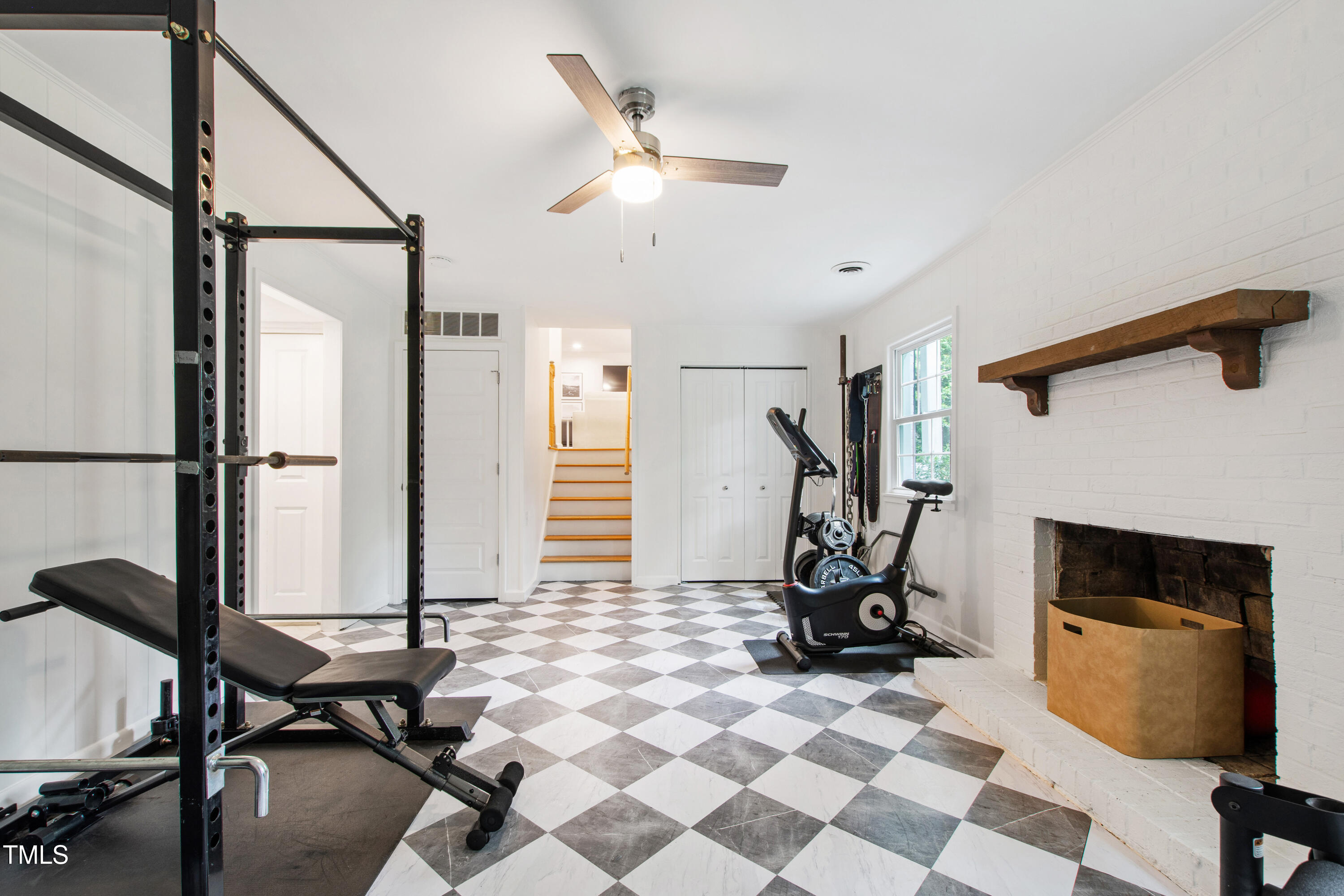 7409 Fiesta Way Raleigh, NC 27615 - Photo 30 of 40 a view of a workspace with furniture and a fireplace