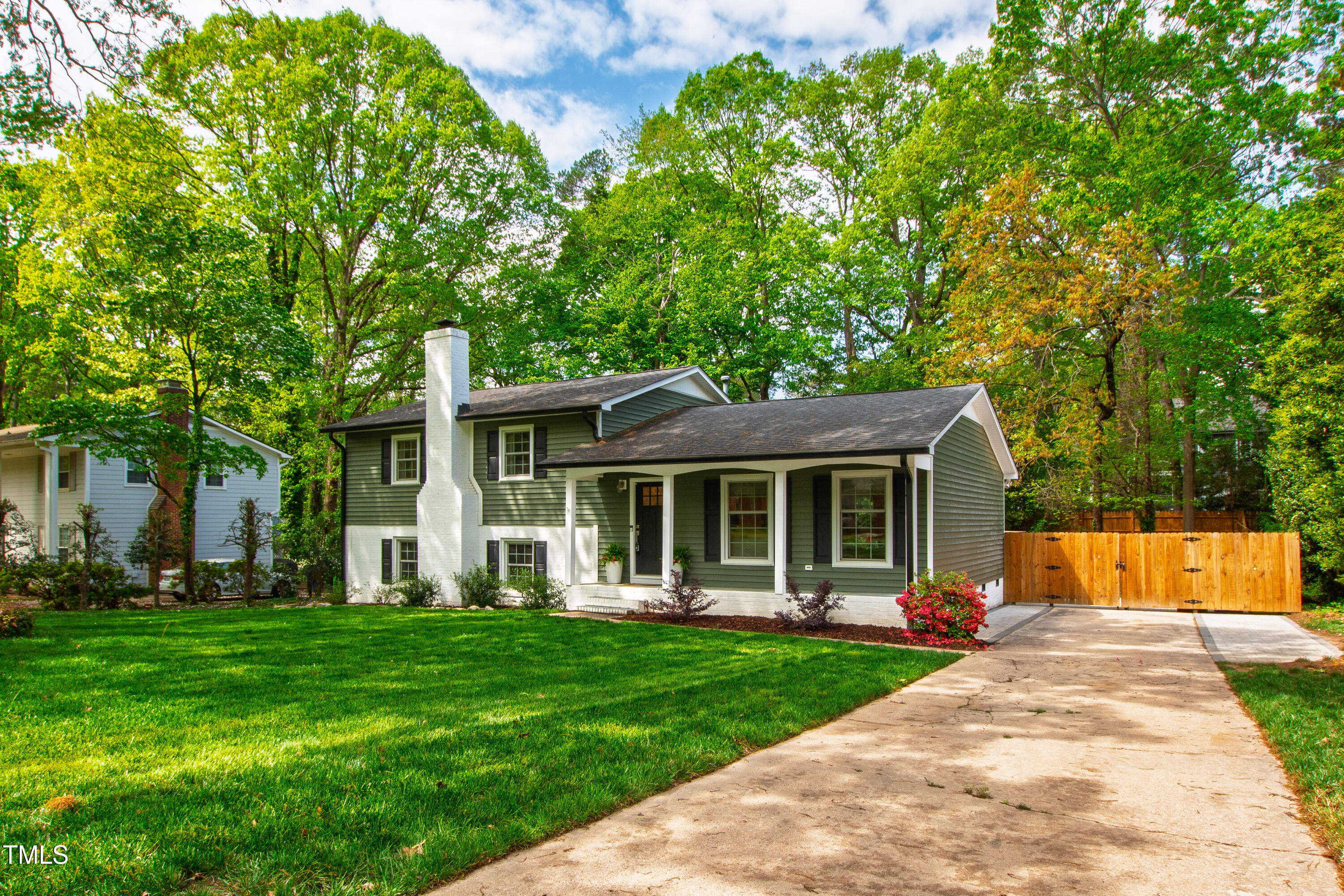7409 Fiesta Way Raleigh, NC 27615 - Photo 3 of 40 a front view of house with yard and green space