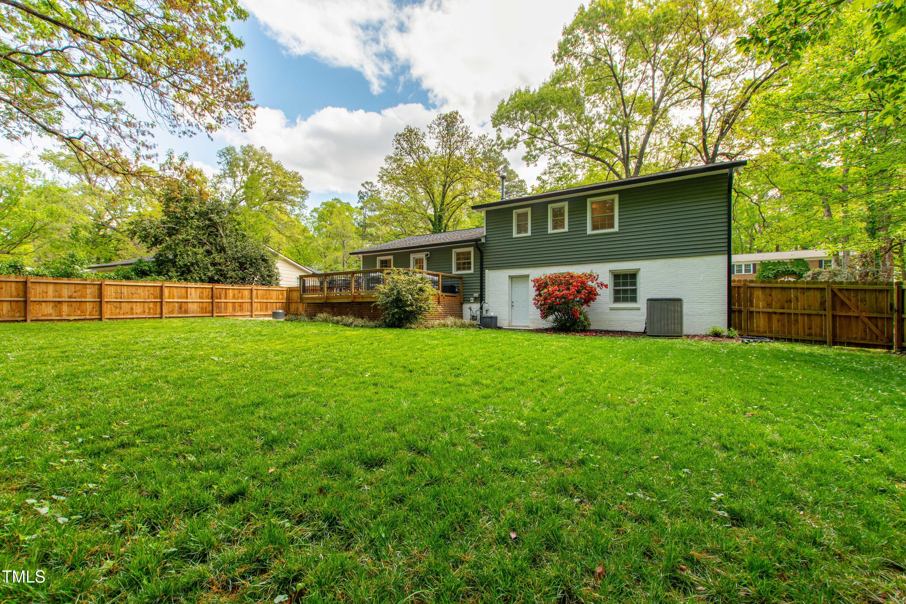 7409 Fiesta Way Raleigh, NC 27615 - Photo 38 of 40 a front view of a house with garden