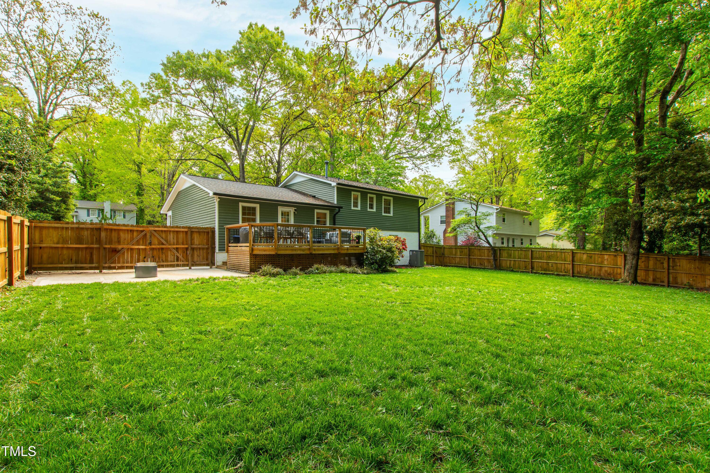 7409 Fiesta Way Raleigh, NC 27615 - Photo 39 of 40 a view of a house with backyard and a garden