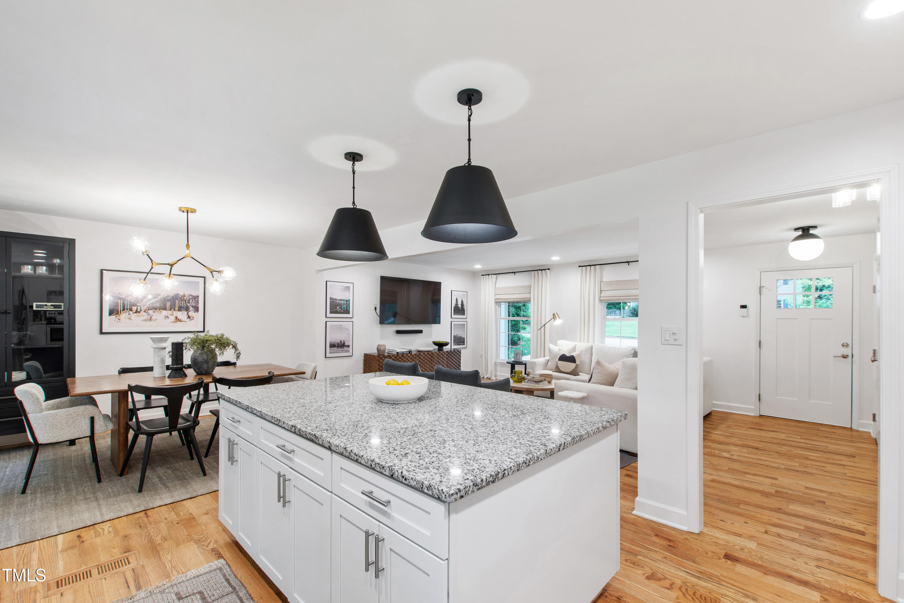 7409 Fiesta Way Raleigh, NC 27615 - Photo 7 of 40 a kitchen with a stove and a wooden floor