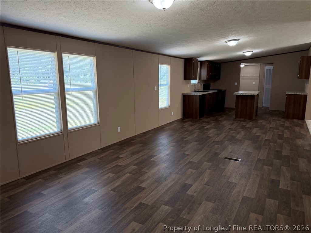 4339 Saddletree Road Lumberton, NC 28360 - Photo 23 of 23 a view of a kitchen with furniture and a window