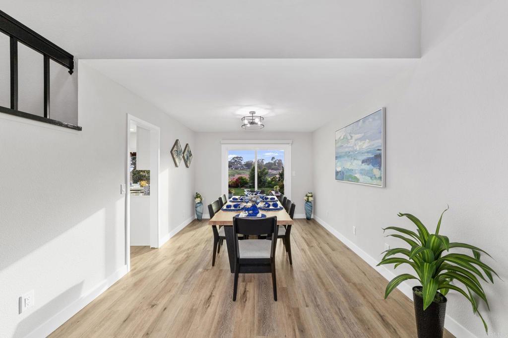 460 Compass Road Oceanside, CA 92054 - Photo 11 of 45 a dining room with furniture and wooden floor