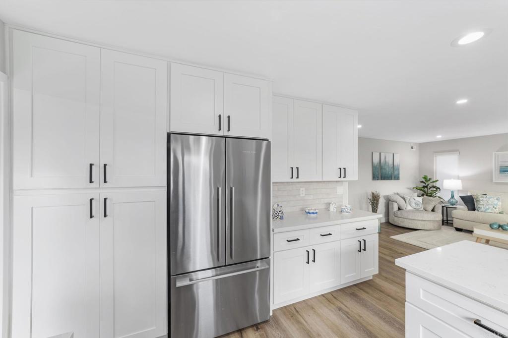 460 Compass Road Oceanside, CA 92054 - Photo 14 of 45 a kitchen with stainless steel appliances a refrigerator sink and cabinets