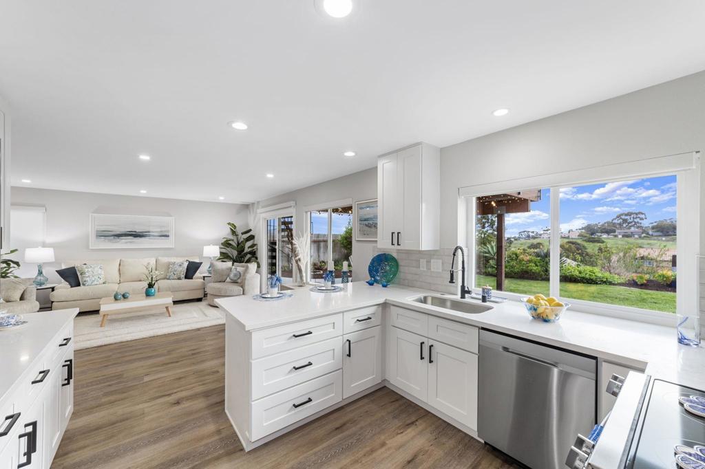 460 Compass Road Oceanside, CA 92054 - Photo 15 of 45 a large white kitchen with a large window
