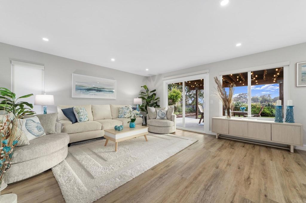 460 Compass Road Oceanside, CA 92054 - Photo 16 of 45 a living room with furniture and a large window