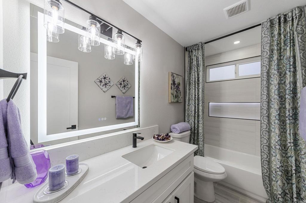 460 Compass Road Oceanside, CA 92054 - Photo 38 of 45 a bathroom with a sink toilet and shower
