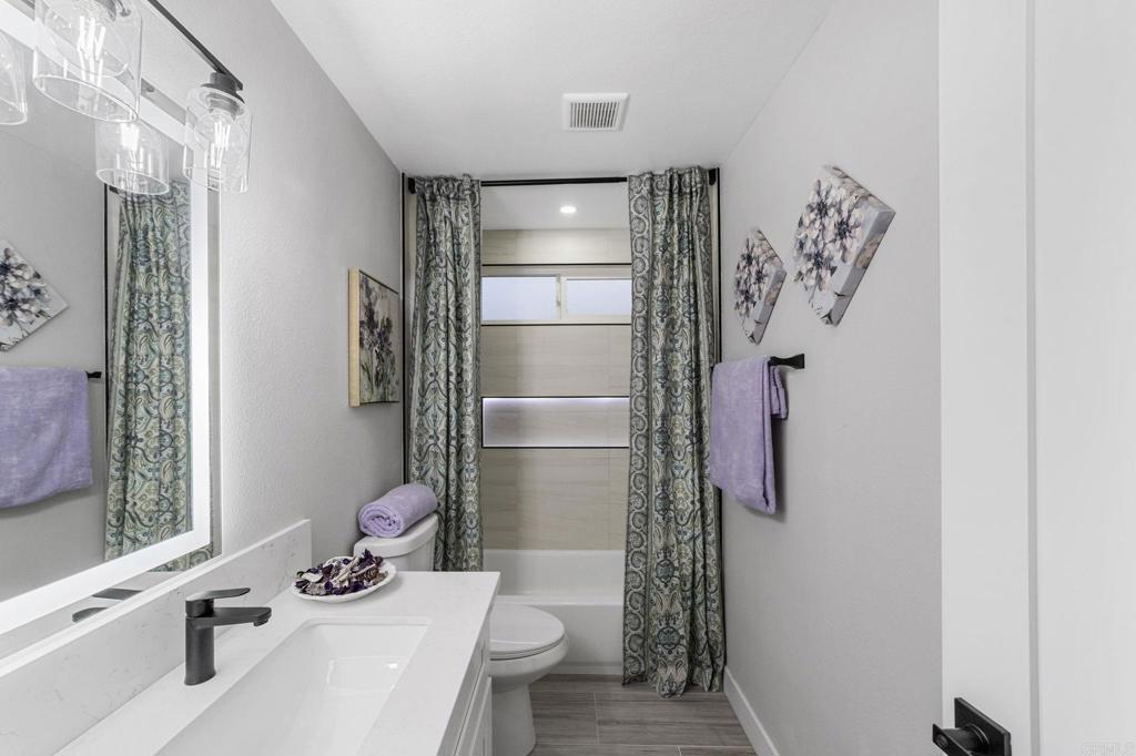 460 Compass Road Oceanside, CA 92054 - Photo 40 of 45 a bathroom with a bathtub and shower