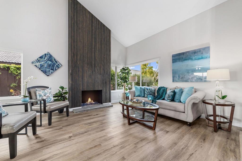 460 Compass Road Oceanside, CA 92054 - Photo 6 of 45 a living room with furniture a fireplace and a table