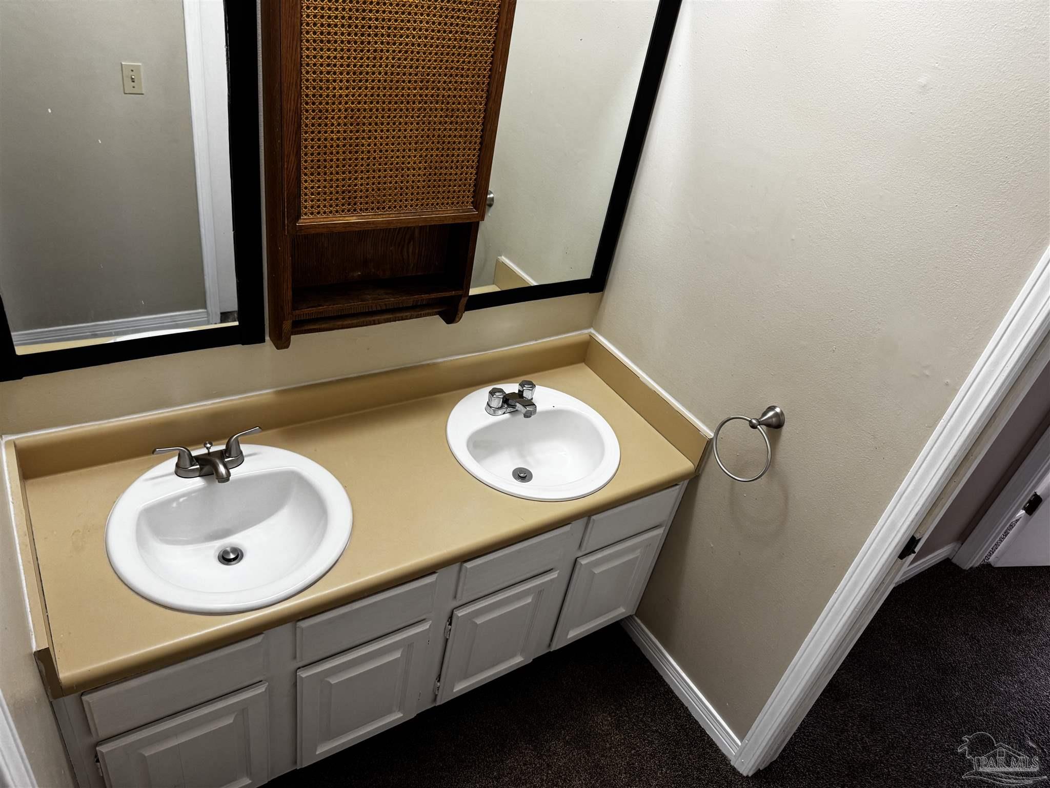 8210 Kipling Street, Unit B Pensacola, FL 32514 - Photo 11 of 17 a bathroom with a sink and a mirror