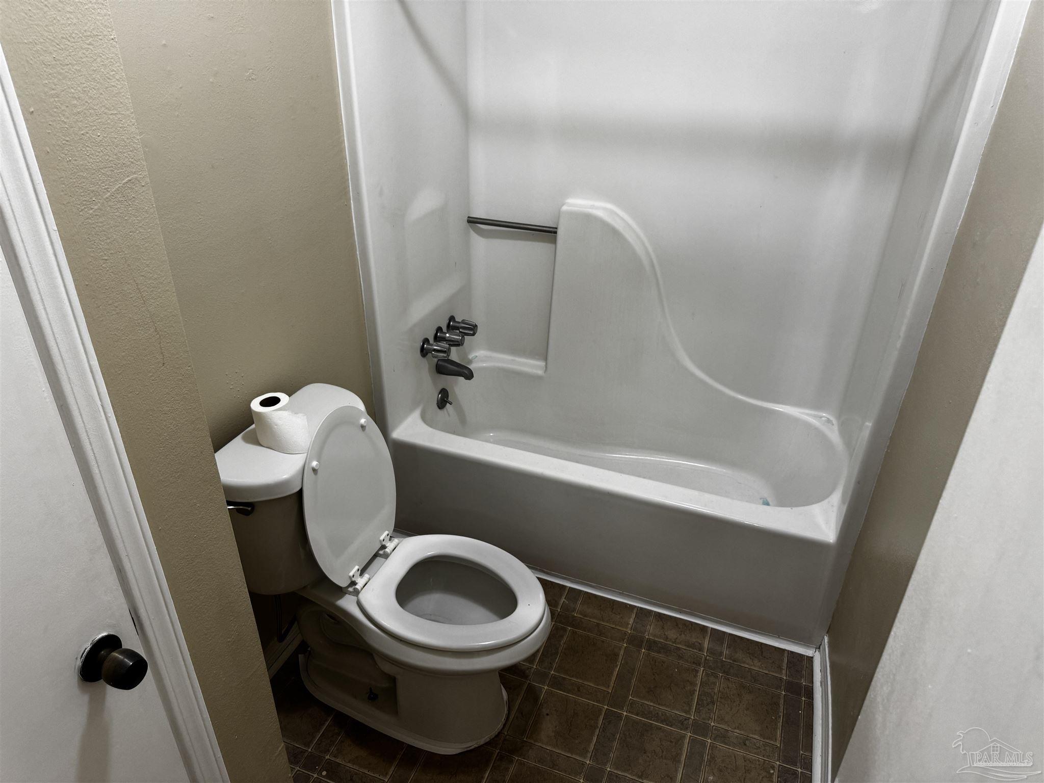8210 Kipling Street, Unit B Pensacola, FL 32514 - Photo 12 of 17 a bathroom with a toilet and a sink