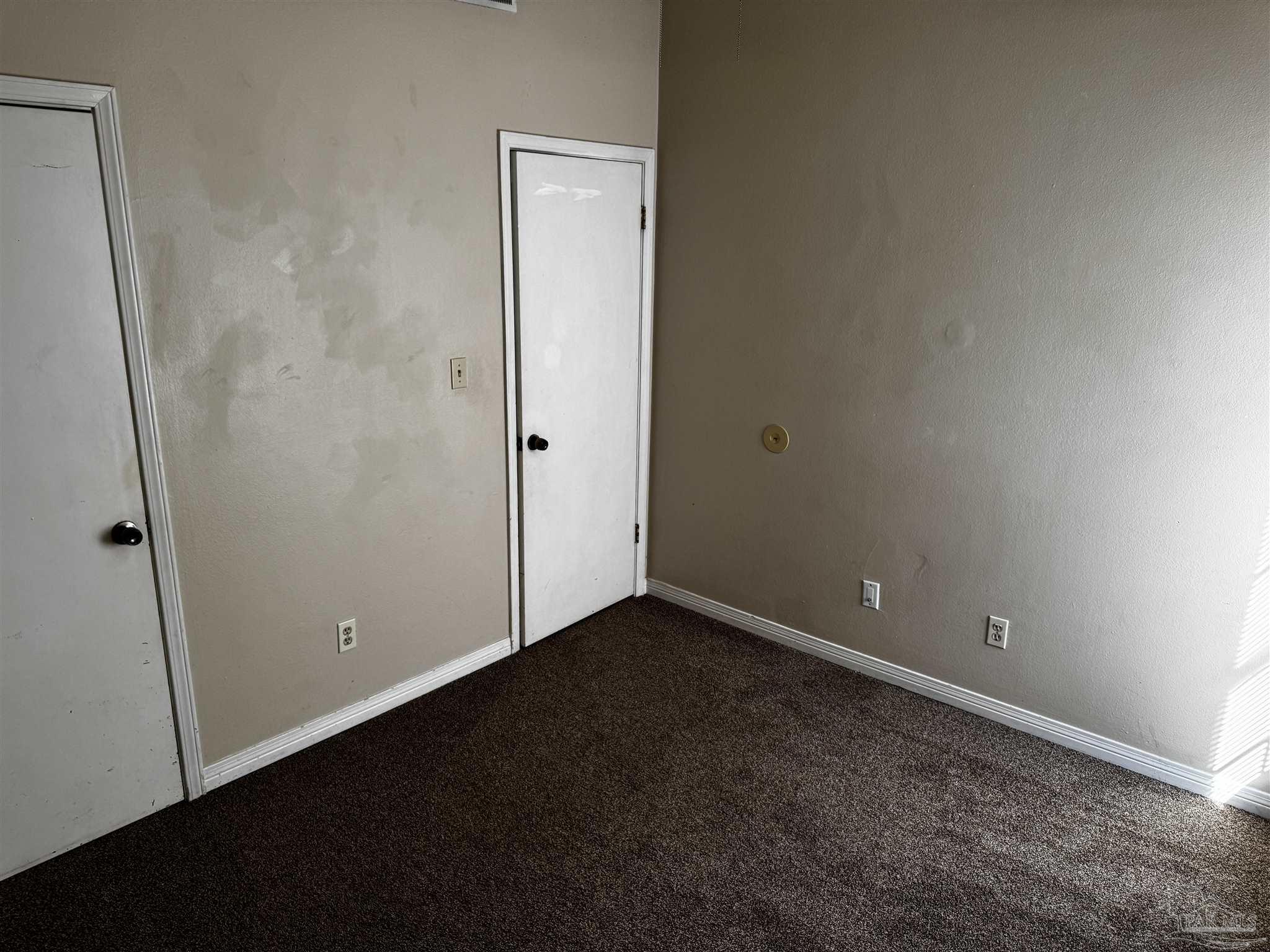8210 Kipling Street, Unit B Pensacola, FL 32514 - Photo 17 of 17 an empty room with closet area