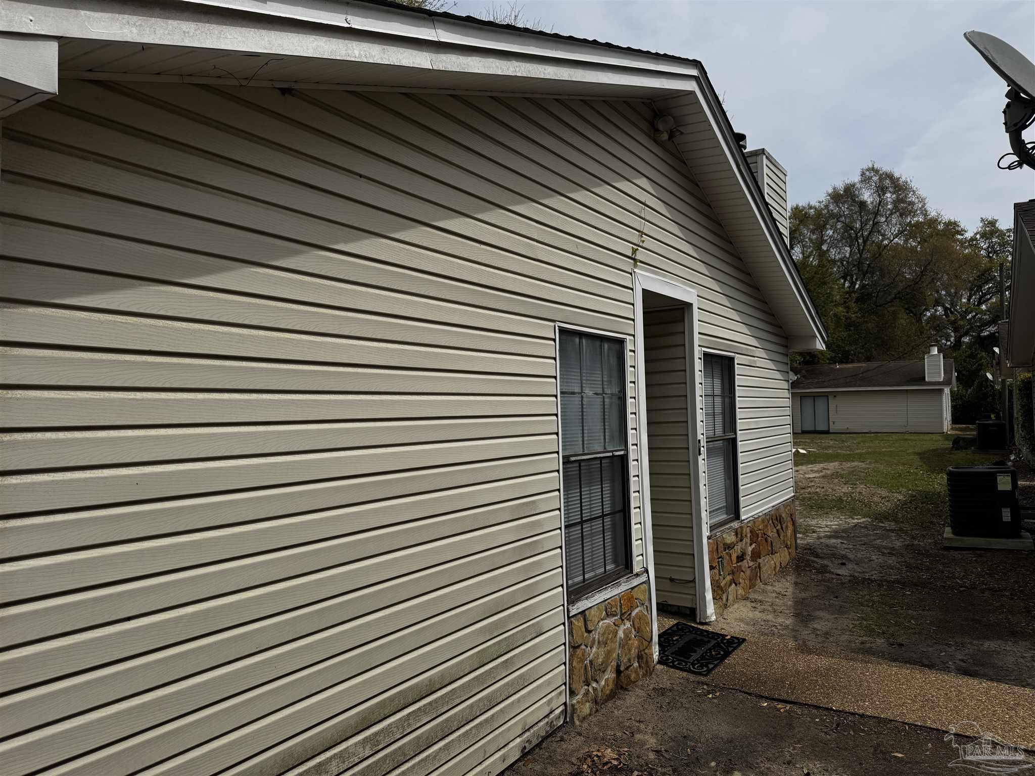 8210 Kipling Street, Unit B Pensacola, FL 32514 - Photo 2 of 17 a view of backyard of a house