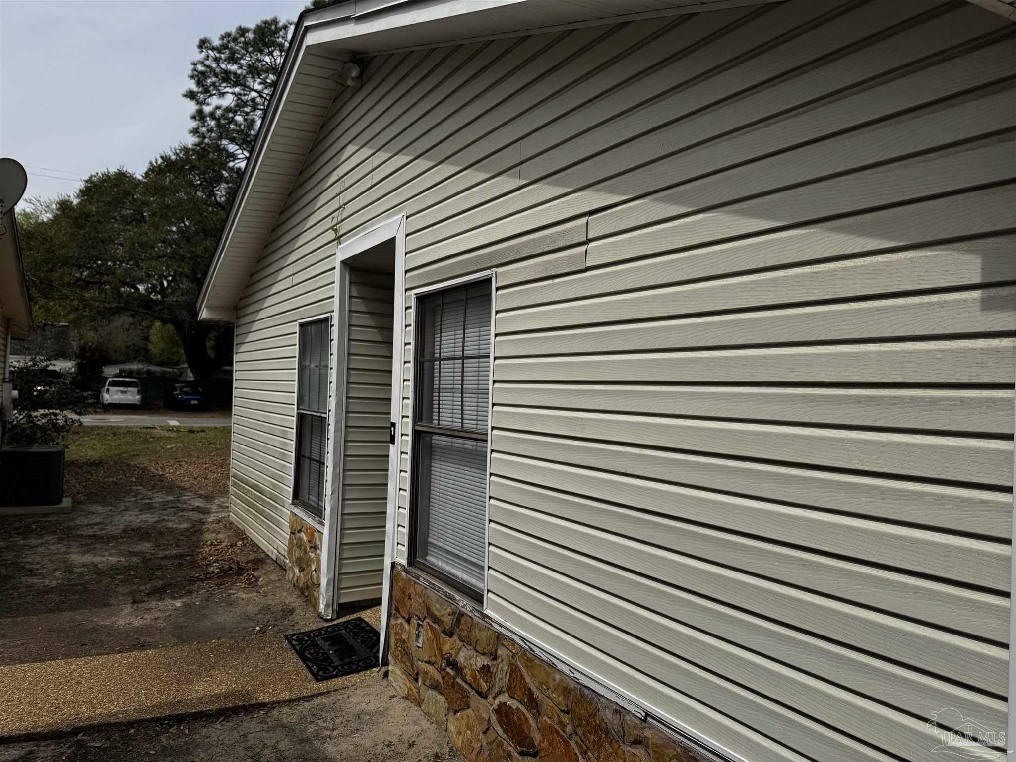 8210 Kipling Street, Unit B Pensacola, FL 32514 - Photo 3 of 17 a view of backyard of a house
