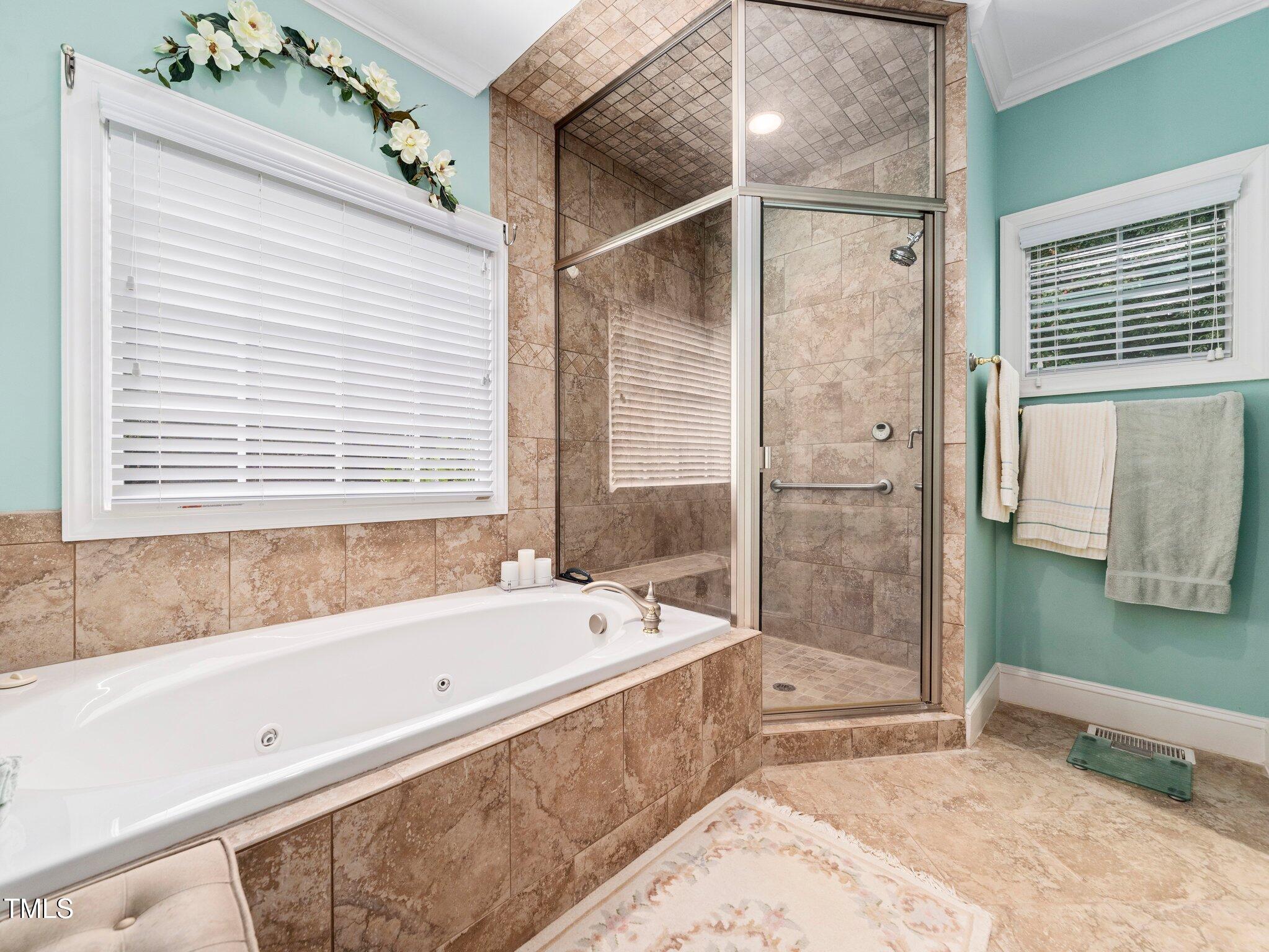 10937 Cahill Road Raleigh, NC 27614 - Photo 32 of 53 Spa-like Primary Bath has Steam Shower & Linen Closet