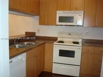 a kitchen with a stove and a microwave