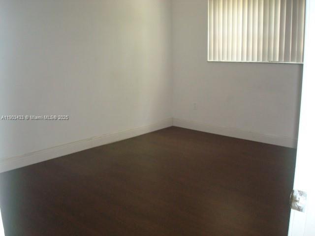 18230 Mediterranean Boulevard, Unit 1306 Hialeah, FL 33015 - Photo 7 of 15 an empty room with a window