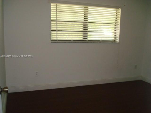 18230 Mediterranean Boulevard, Unit 1306 Hialeah, FL 33015 - Photo 8 of 15 an empty room with a window