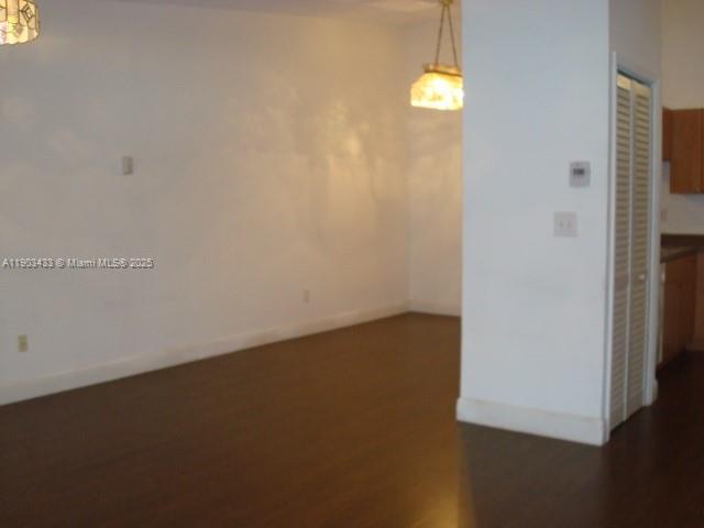 18230 Mediterranean Boulevard, Unit 1306 Hialeah, FL 33015 - Photo 10 of 15 an empty room with windows and entrance
