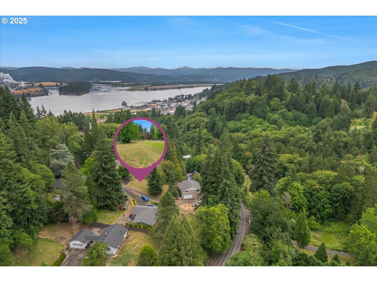 0 Maple Drive, Unit 2 Rainier, OR 97048 - Photo 2 of 5 a view of a lake with a yard