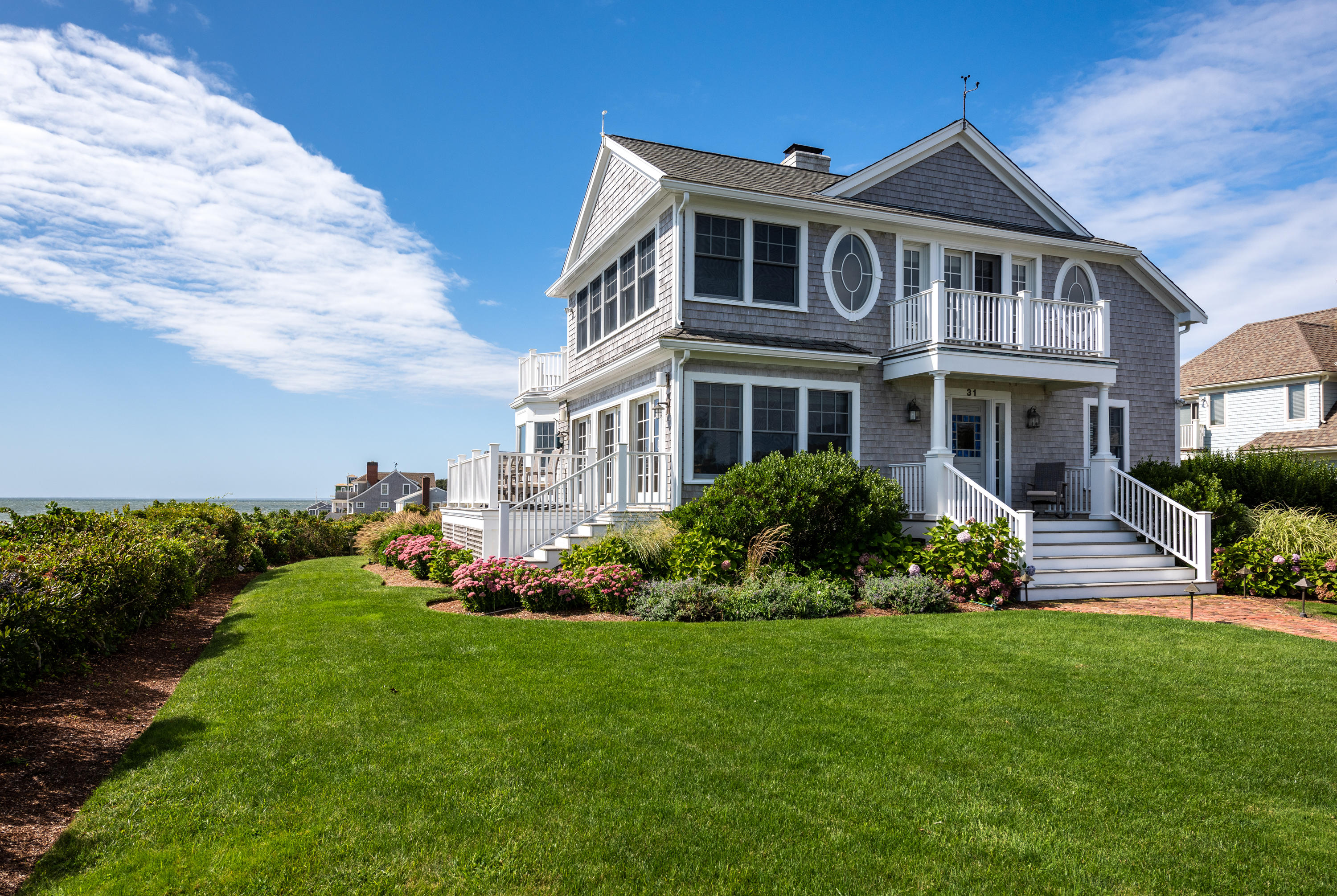 31 Starboard Lane Mashpee, MA 02649 - Photo 1 of 49 a front view of a house with a yard