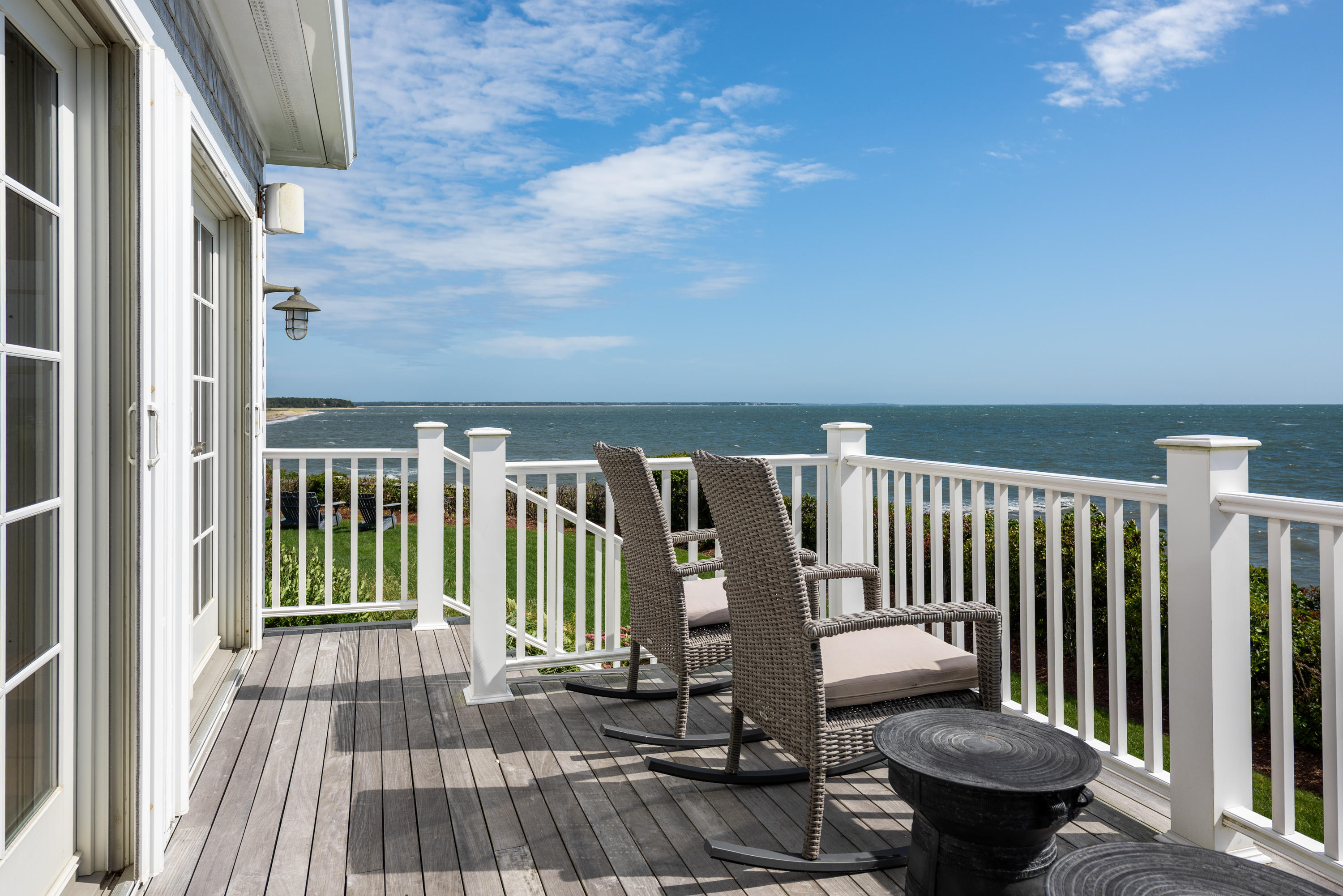31 Starboard Lane Mashpee, MA 02649 - Photo 13 of 49 a view of a balcony with chair and wooden floor