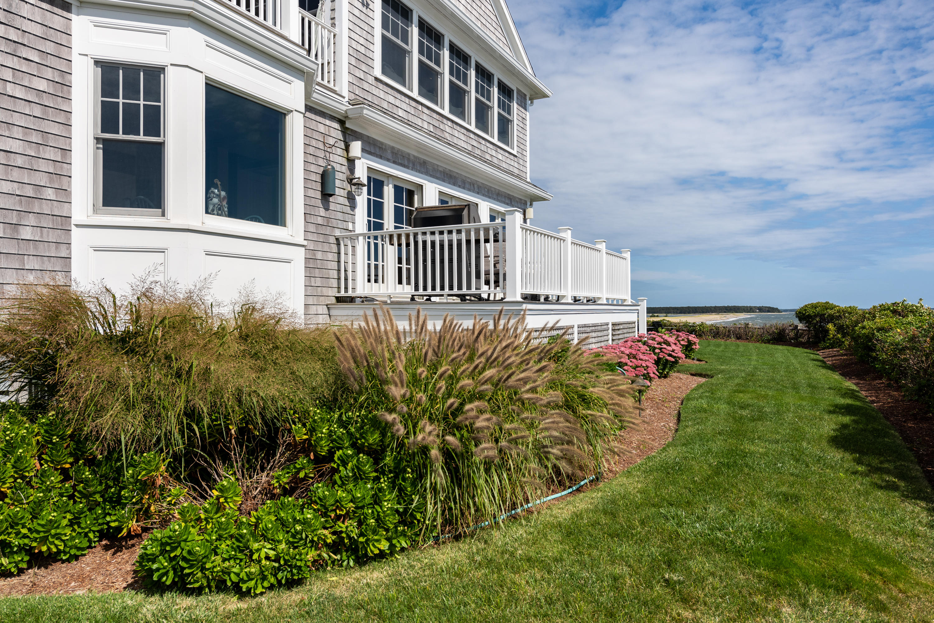 31 Starboard Lane Mashpee, MA 02649 - Photo 16 of 49 front view of a house with a yard