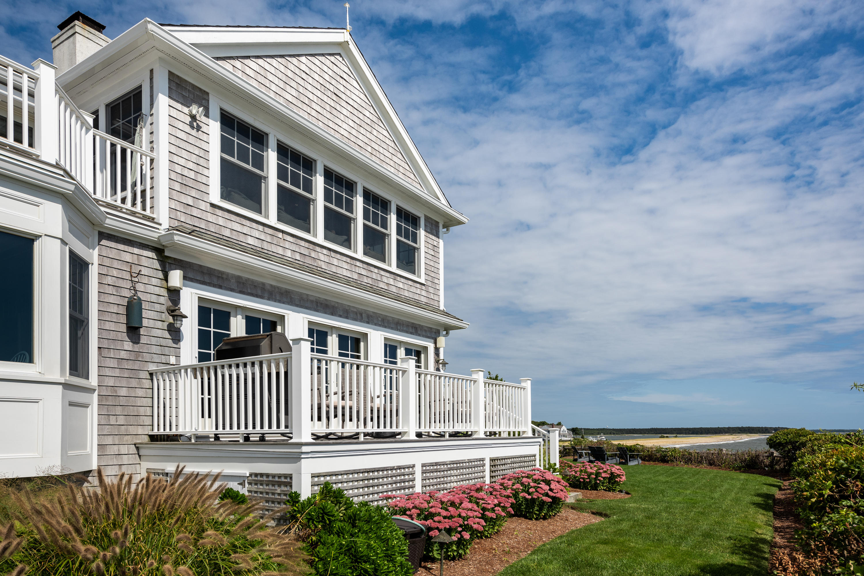 31 Starboard Lane Mashpee, MA 02649 - Photo 17 of 49 front view of a house with a yard