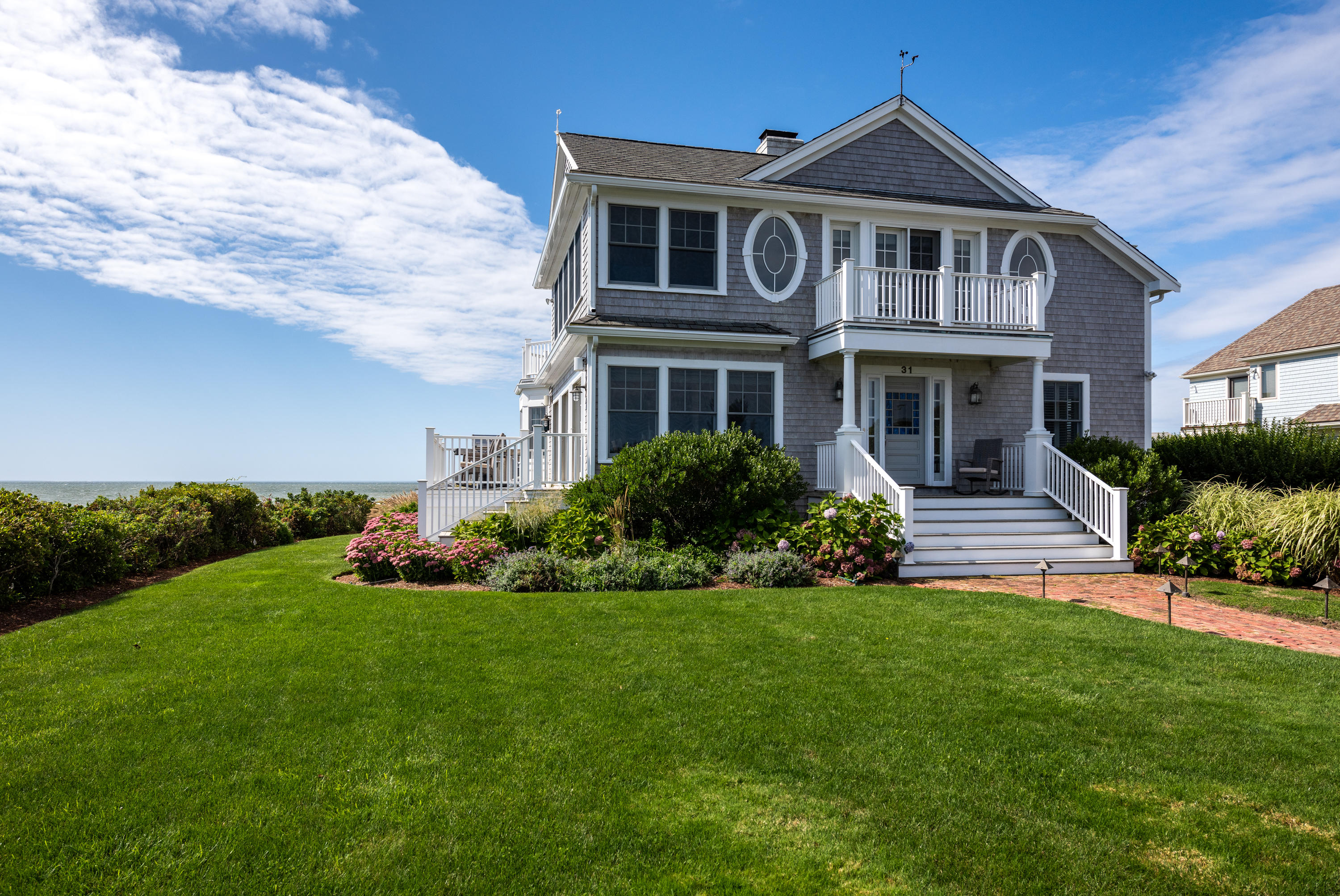 31 Starboard Lane Mashpee, MA 02649 - Photo 6 of 49 a front view of a house with a yard