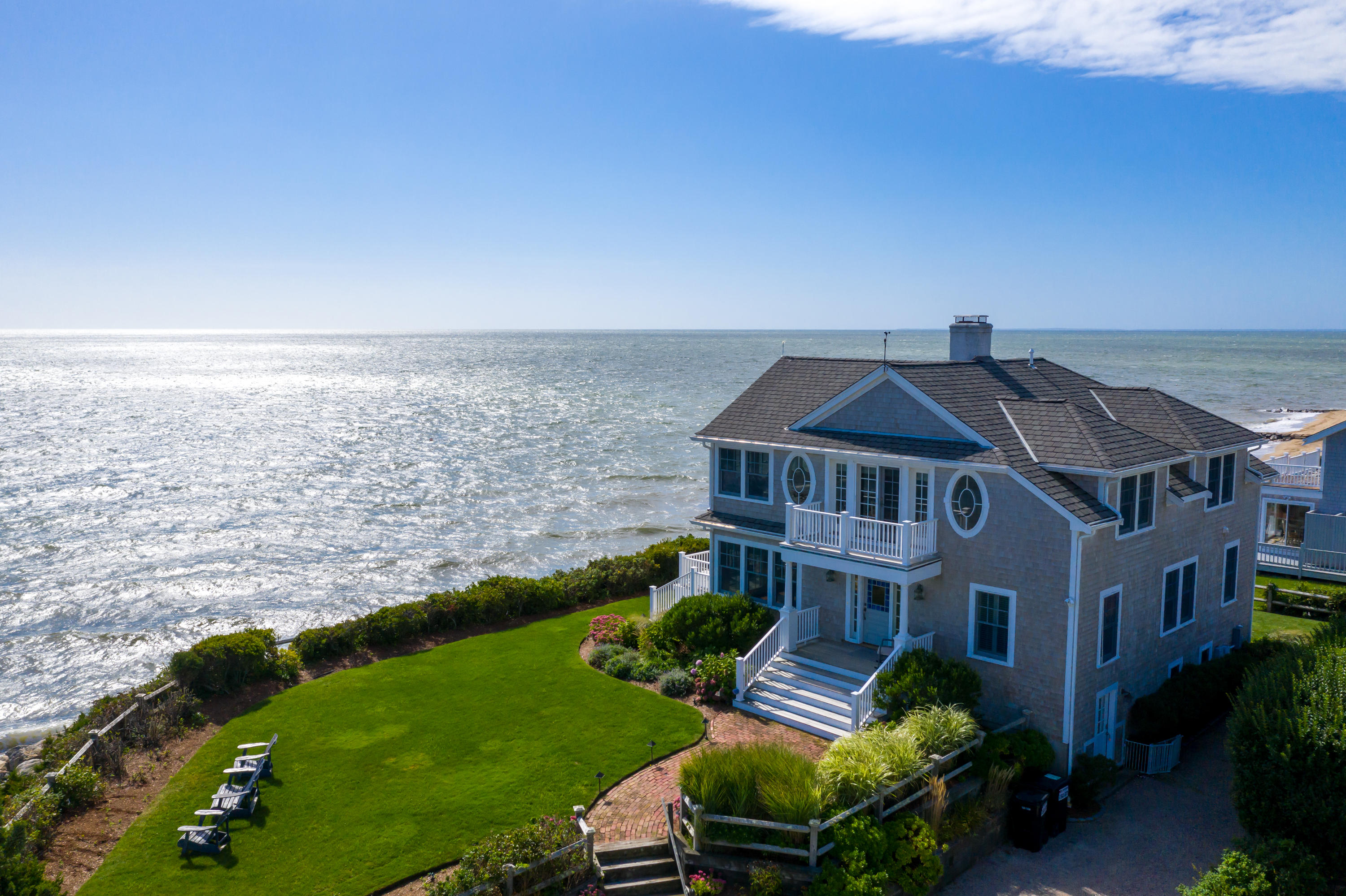 31 Starboard Lane Mashpee, MA 02649 - Photo 7 of 49 a front view of a house with a garden and lake view
