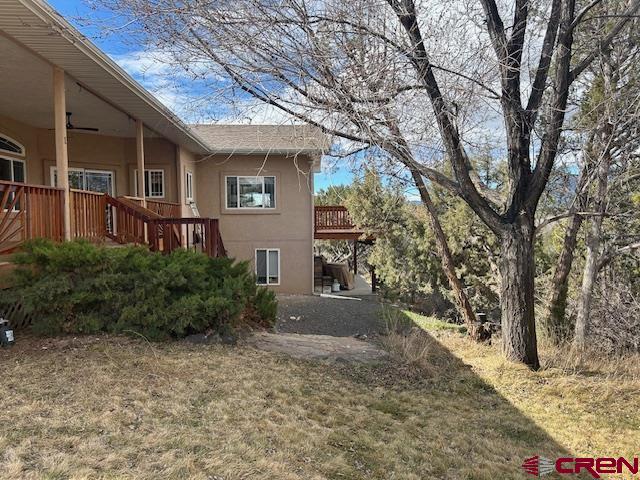 16609 Columbine Lane Cedaredge, CO 81413 - Photo 11 of 39 a front view of a house with garden