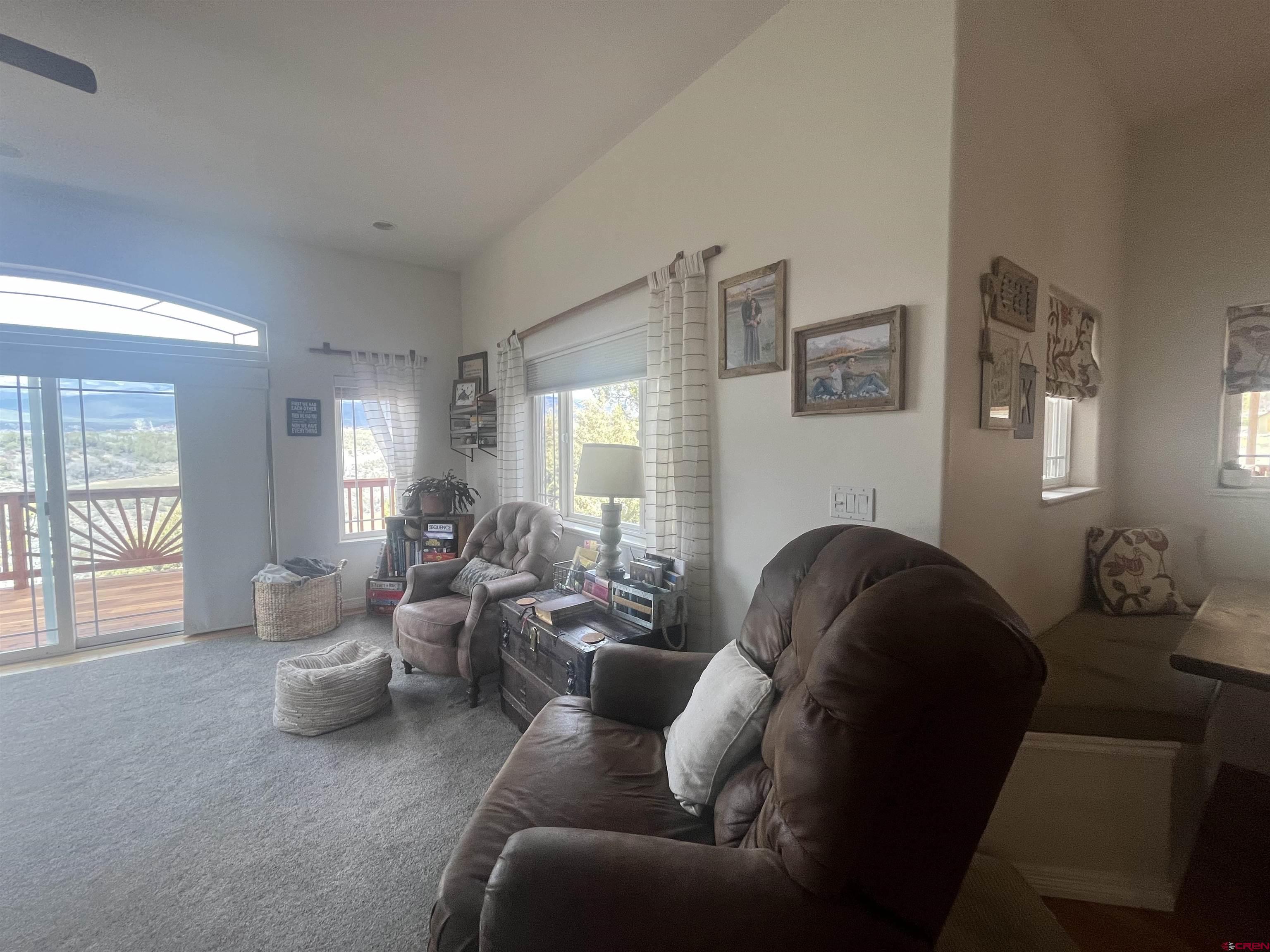 16609 Columbine Lane Cedaredge, CO 81413 - Photo 23 of 39 a living room with furniture and wooden floor