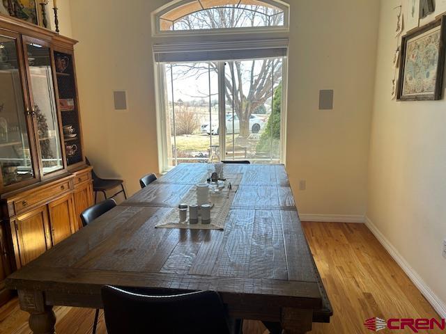 16609 Columbine Lane Cedaredge, CO 81413 - Photo 24 of 39 a view of a dining room with furniture a chandelier and wooden floor