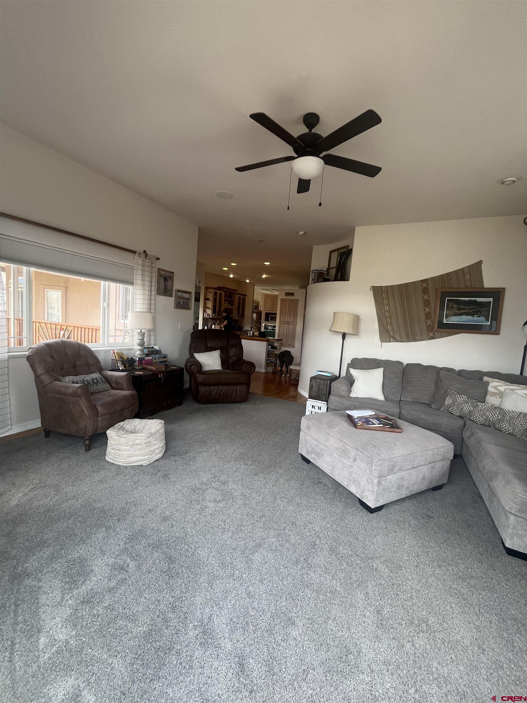 16609 Columbine Lane Cedaredge, CO 81413 - Photo 26 of 39 a living room with furniture and a large window