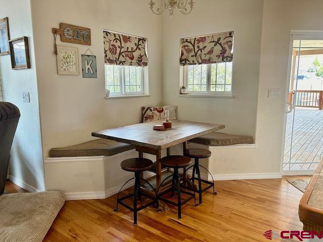 16609 Columbine Lane Cedaredge, CO 81413 - Photo 29 of 39 a view of a dining room with furniture and wooden floor