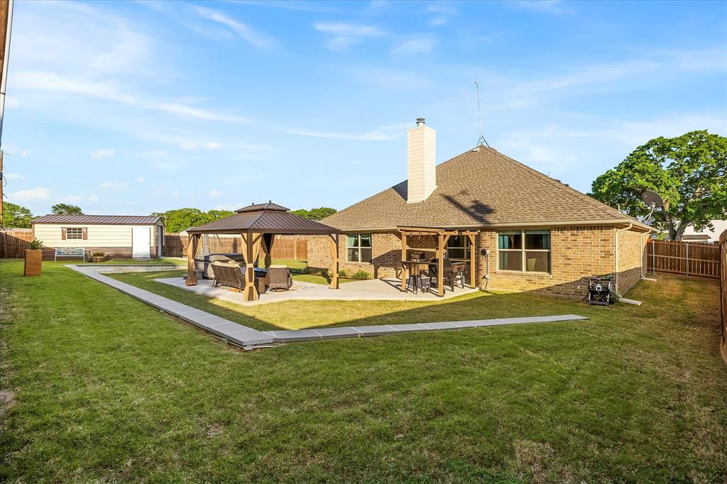 2808 Rodeo Drive Quinlan, TX 75474 - Photo 12 of 39 a front view of a house with a yard