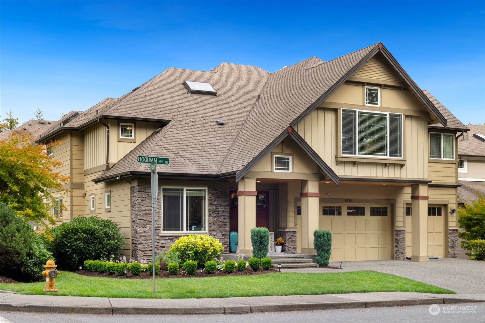 a front view of a house with a yard