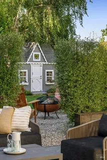 a front view of a house with garden