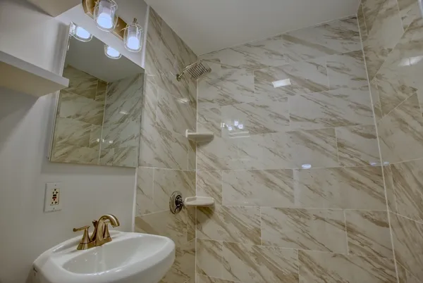 a bathroom with a sink and a mirror