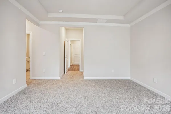 a view of an empty room and closet area
