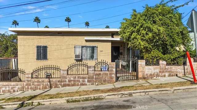 a front view of a house with basket ball court