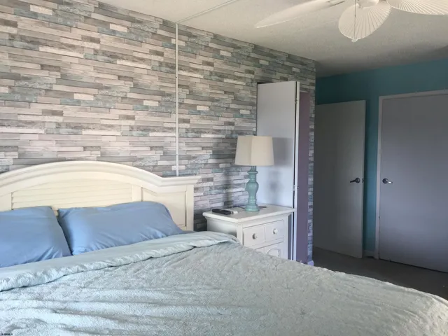 a bedroom with a bed and a cabinets