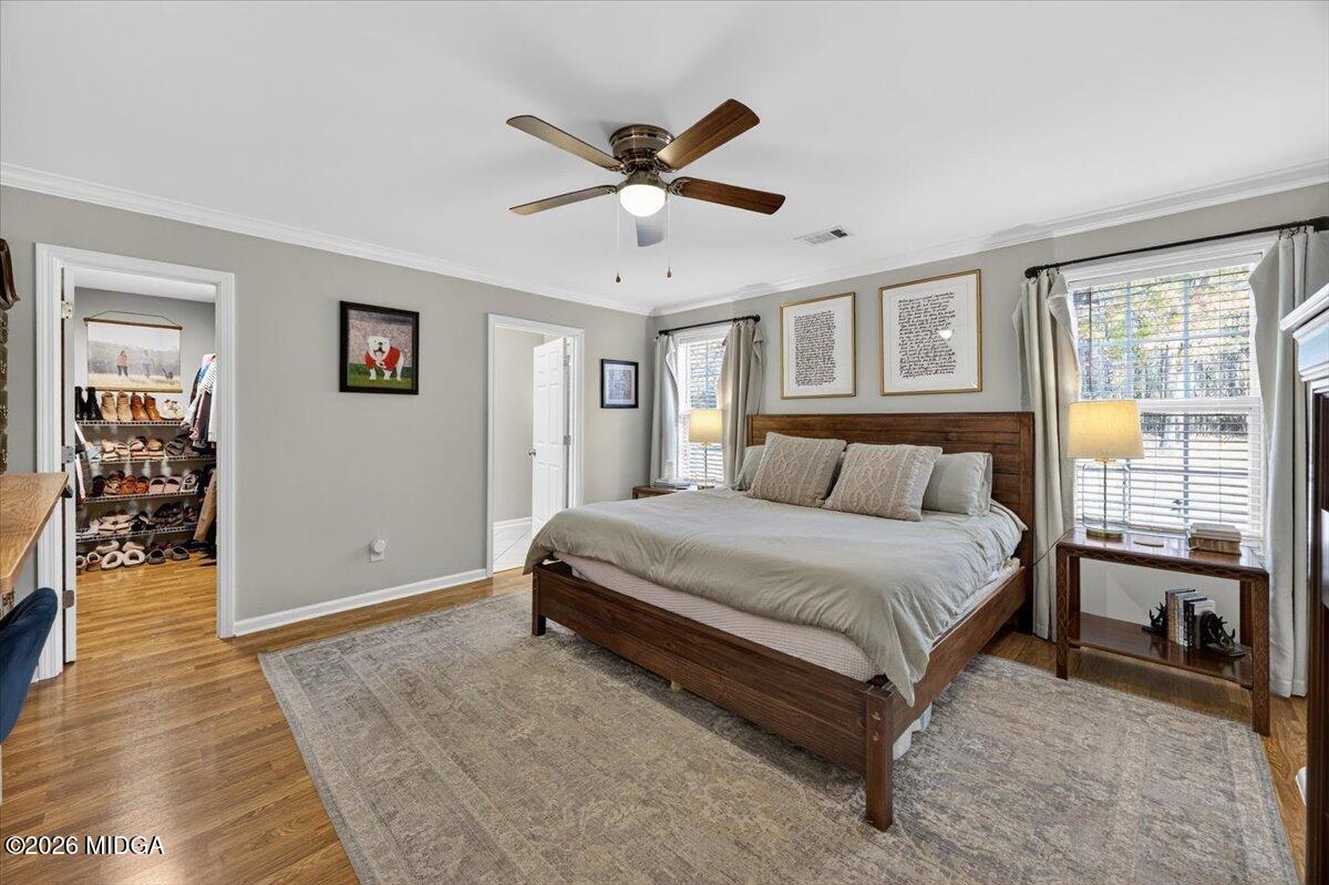 428 Fairview Church Road Forsyth, GA 31029 - Photo 11 of 35 a bedroom with a large bed and a ceiling fan