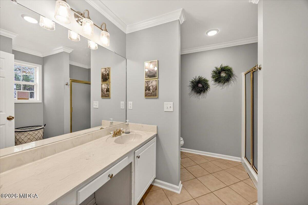 428 Fairview Church Road Forsyth, GA 31029 - Photo 13 of 35 a spacious bathroom with a granite countertop sink a mirror and a shower