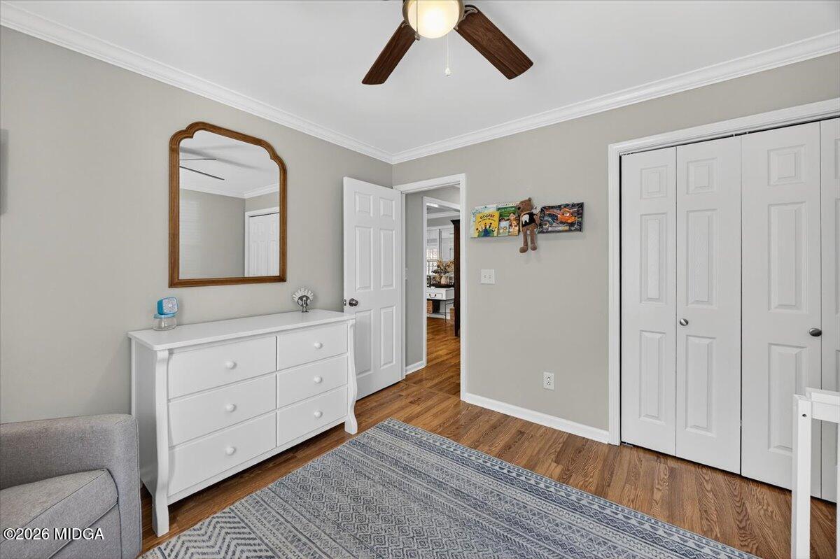 428 Fairview Church Road Forsyth, GA 31029 - Photo 16 of 35 a spacious bedroom with a bed and a mirror on the dresser