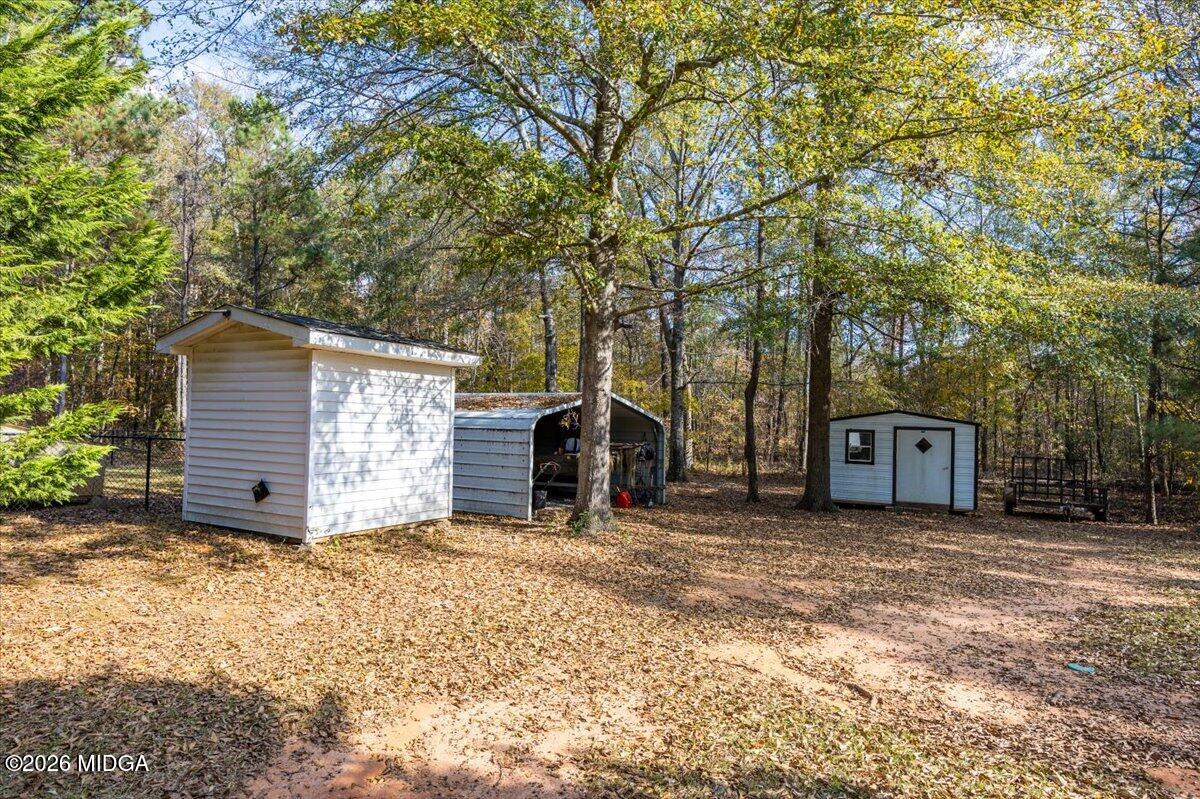 428 Fairview Church Road Forsyth, GA 31029 - Photo 25 of 35 a view of a house with a large tree and many windows