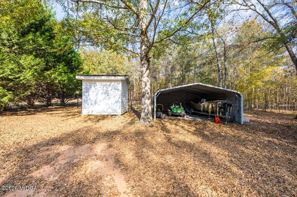 428 Fairview Church Road Forsyth, GA 31029 - Photo 27 of 35 a front view of a house with a yard and garage