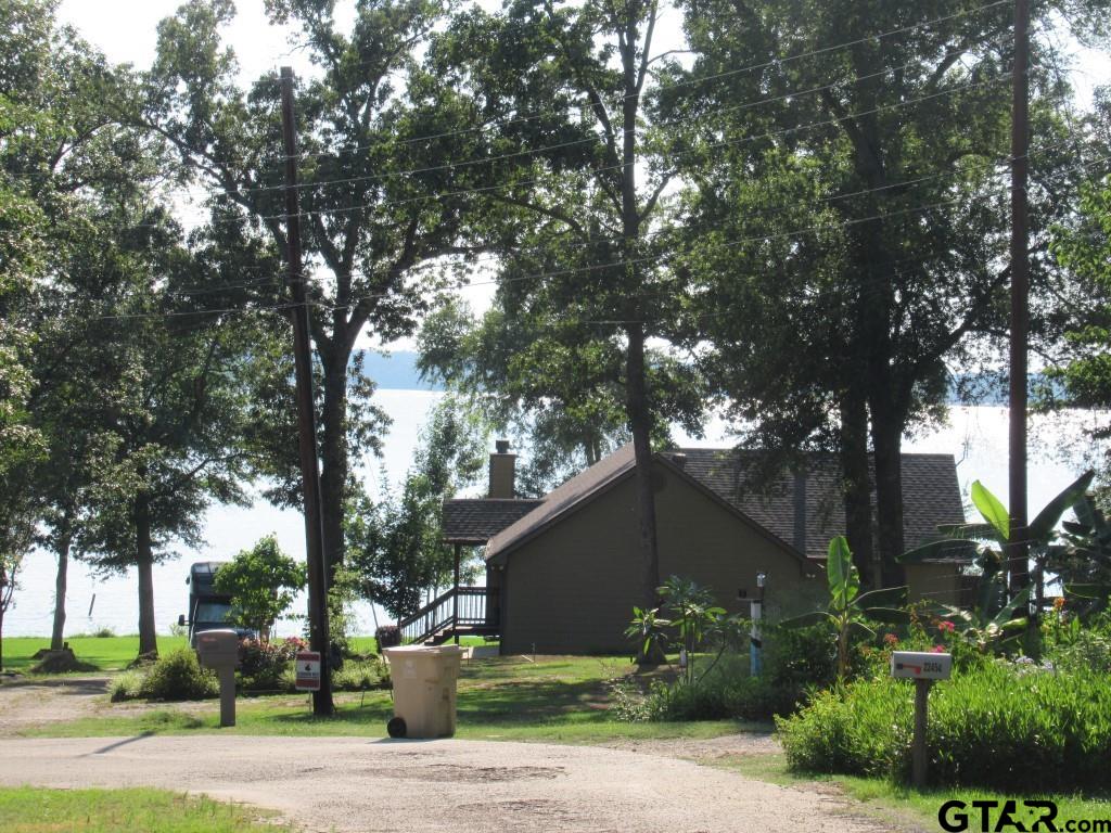 22448 Shady Trail Flint, TX 75762 - Photo 8 of 8 a front view of a house with garden